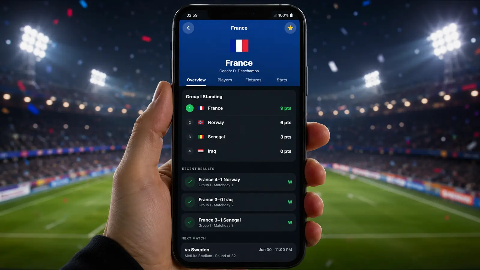 GoalTrack World Cup 2026 screen on a smartphone with a night stadium behind